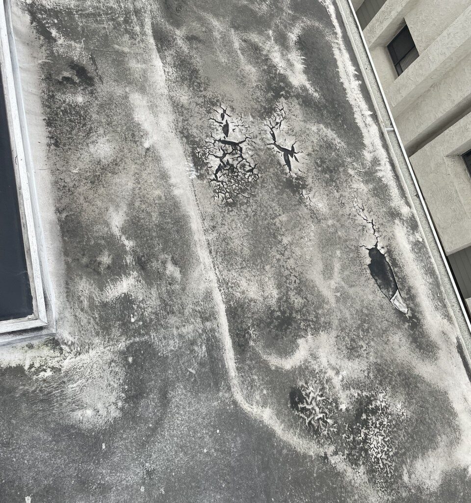 Close view of roof surface and leak-prone details before preparation.