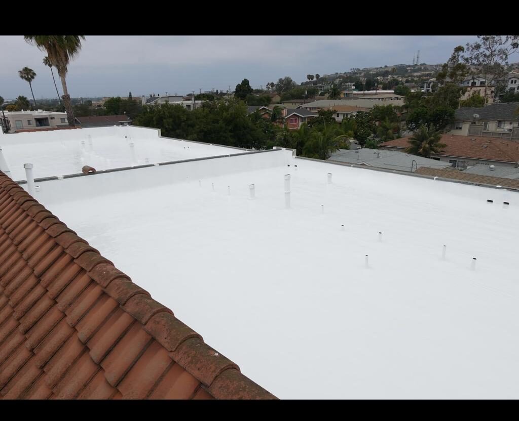 Finished reflective white coating system after rock roof restoration in Long Beach.
