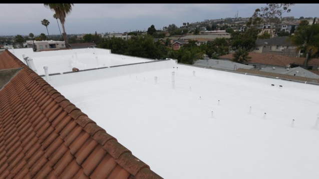 Finished reflective white coating system after rock roof restoration in Long Beach.