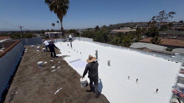 Long Beach apartment building roof conversion with gravel removal and new white coating system.